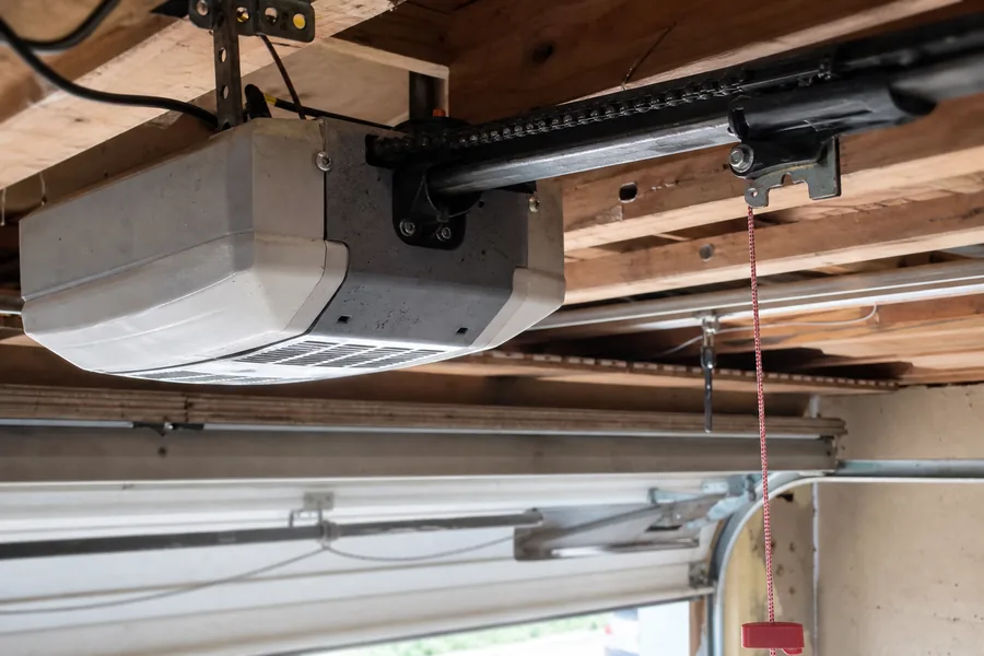 A garage door opener motor and rail in a Lincoln, NE garage